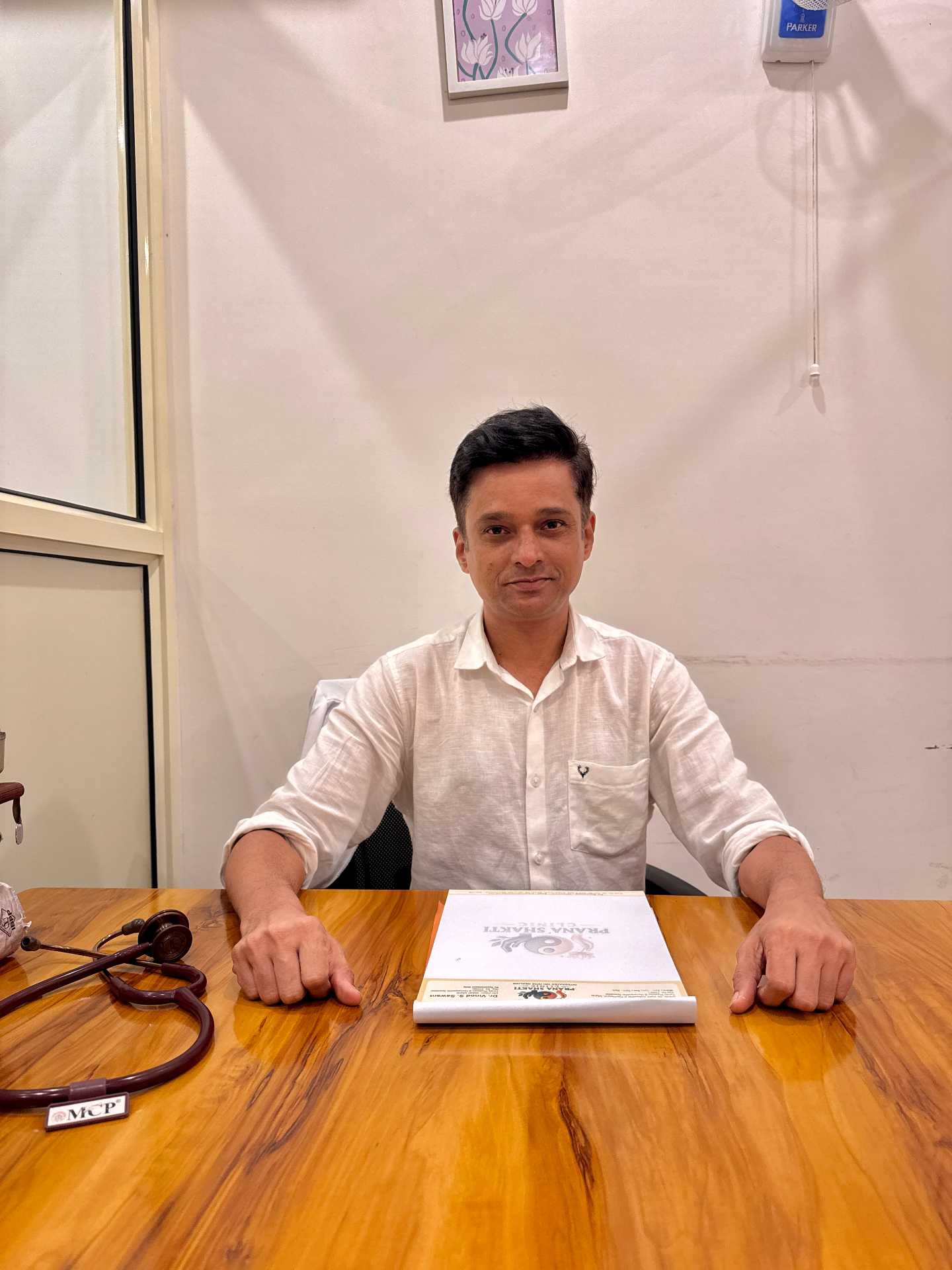 Doctor at consultation desk